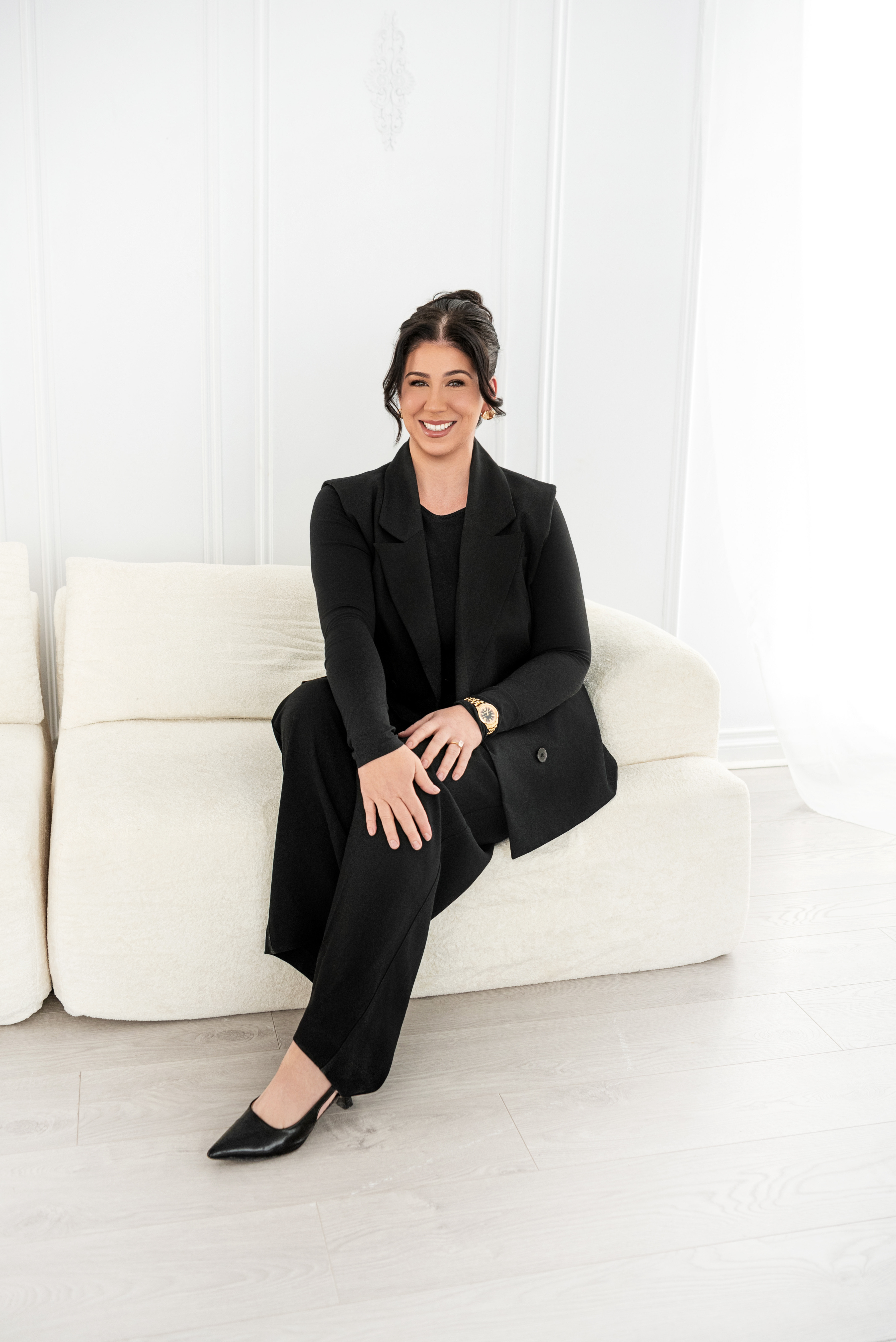 Juliana Nayler seated on couch